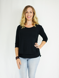 Three-quarter length sleeve breastfeeding shirt in black to go with everything and hiding nursing stains. Made with a buttery-soft viscose blend. Designed in the US. 